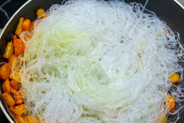 Glass noodles cellophane closeup in the pan