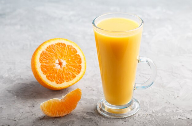 Glass of orange juice. Side view