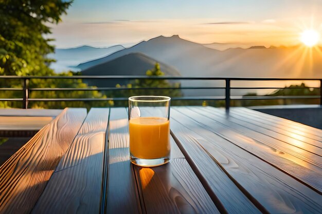 Glass of orange juice on a table with a view of the mountains