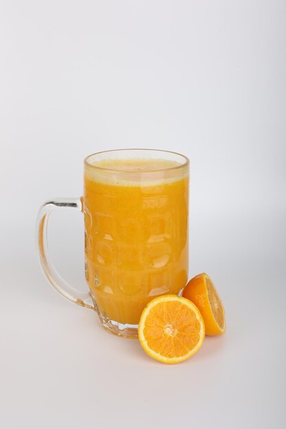 A glass of orange juice with a slice of orange on it