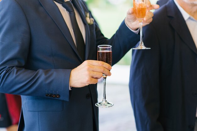 A glass of pink champagne in the hands