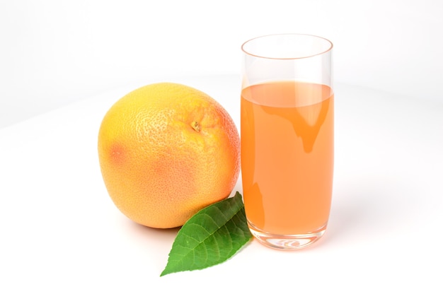 Glass of pink grapefruit juice isolated on white cutout