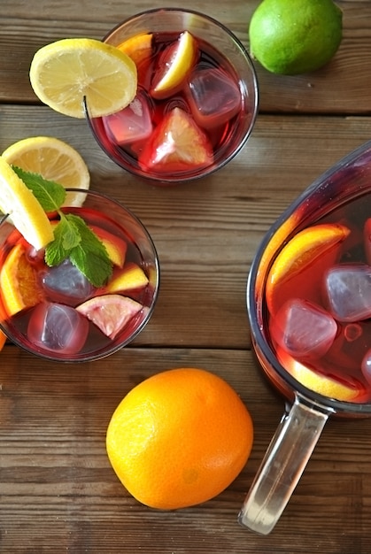 Glass and pitcher of ice cold Sangria