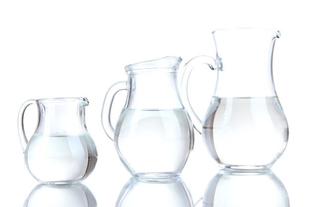 Photo glass pitchers of water isolated on white