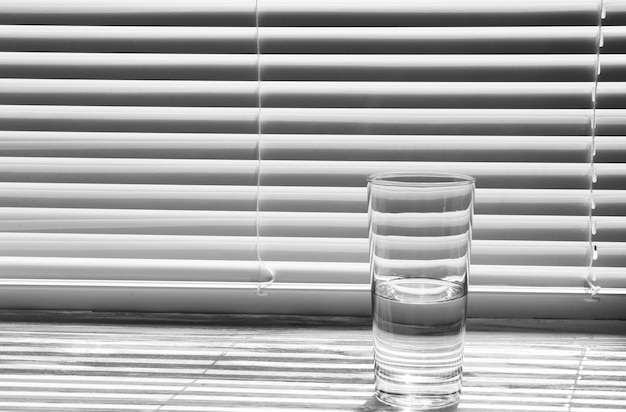 Photo glass of pure water on the windowsill