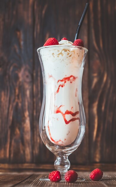 Glass of raspberry milkshake