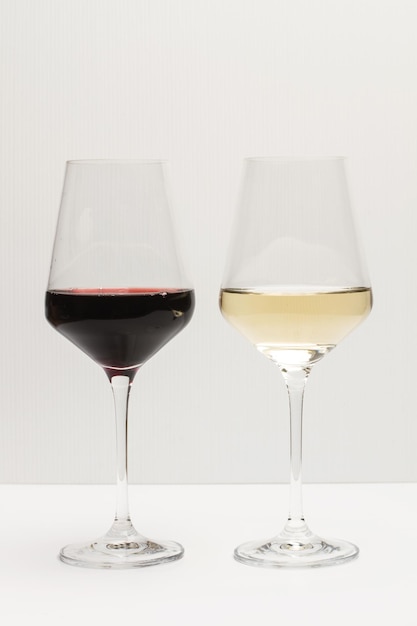 A glass of red wine and a glass of white wine