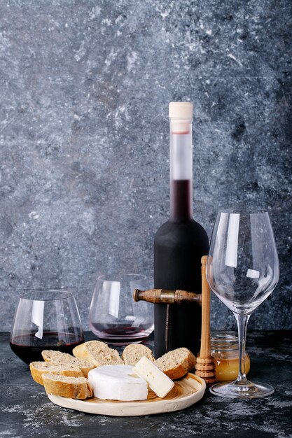 Glass of red wine served with cheese