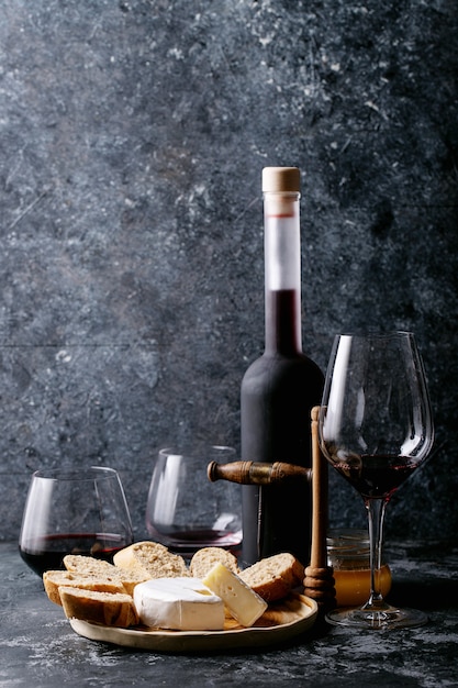 Glass of red wine served with cheese