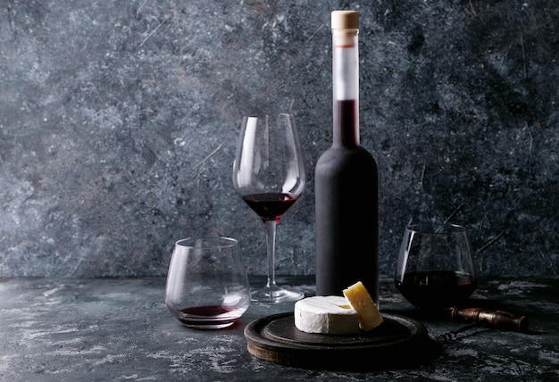 Glass of red wine served with cheese