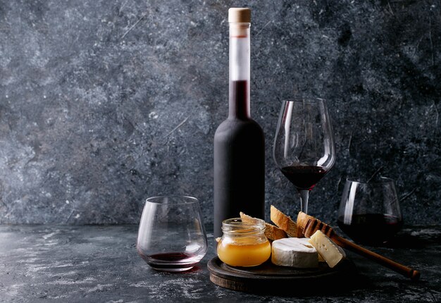 Glass of red wine served with cheese