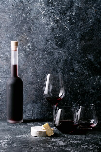 Glass of red wine served with cheese