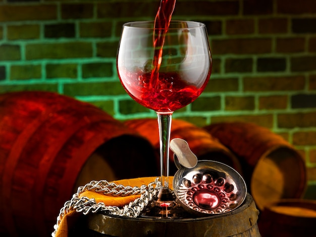 Glass of red wine set in a tasting cellar