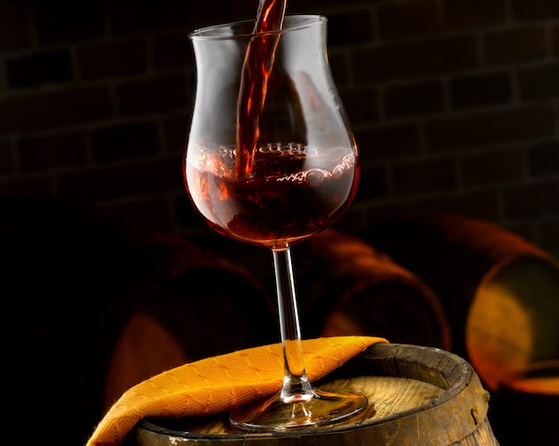 Glass of red wine set in a tasting cellar