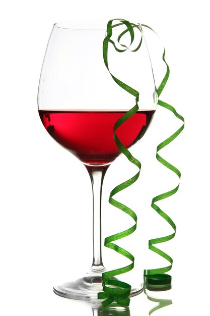 Glass of red wine and streamer after party isolated on white