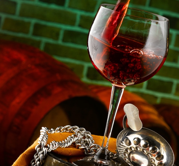 Glass of red wine in a tasting cellar