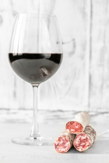 Glass of red wine with fuet - Catalan dry cured sausage