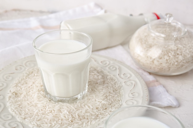 Glass of rice milk on table