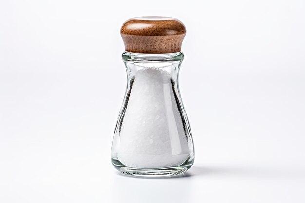 Photo glass salt shaker spills on white background
