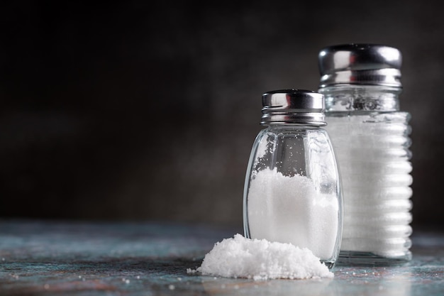 Glass salt shaker on the table