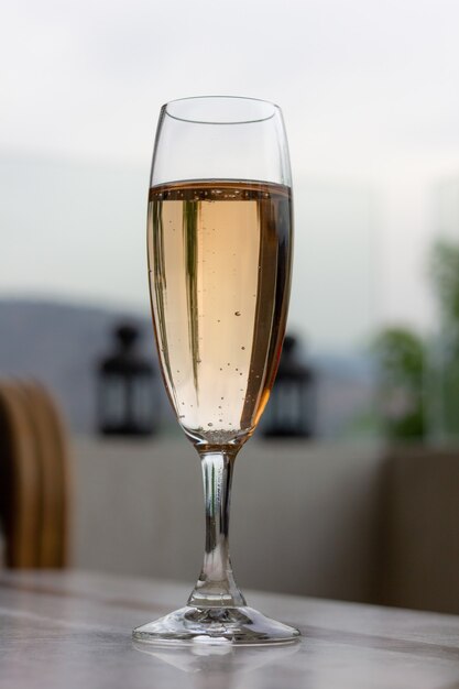 Glass of sparkling rose wine on table Party celebration event concepts