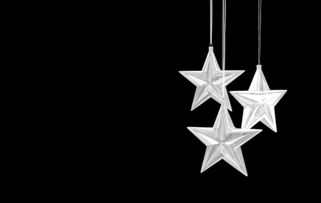 Photo glass star toys hanging on black background