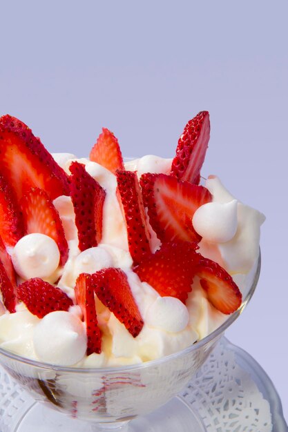 Glass of strawberries dulce de leche and cream