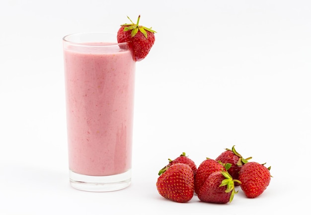 Glass of strawberry smoothie with fresh berries