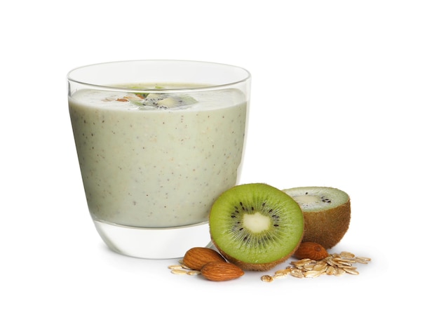 Glass of tasty kiwi smoothie with oatmeal on white background