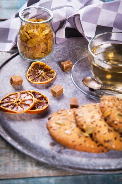 Glass teacup with biscuit cookies