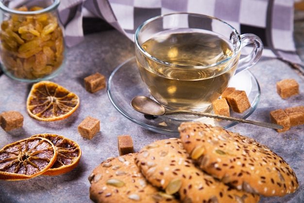 Glass teacup with biscuit cookies