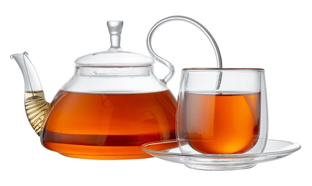 Glass teapot and glass cup with tea isolated on white background