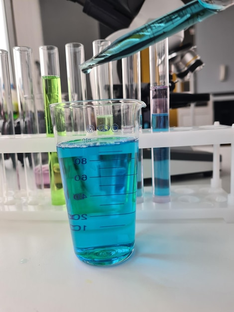 Glass test tube is poured with new liquid solution of potassium blue