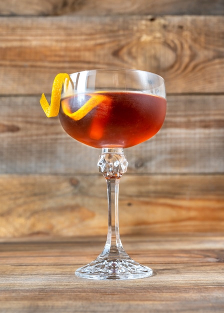 Glass of Tipperary cocktail garnished with orange twist
