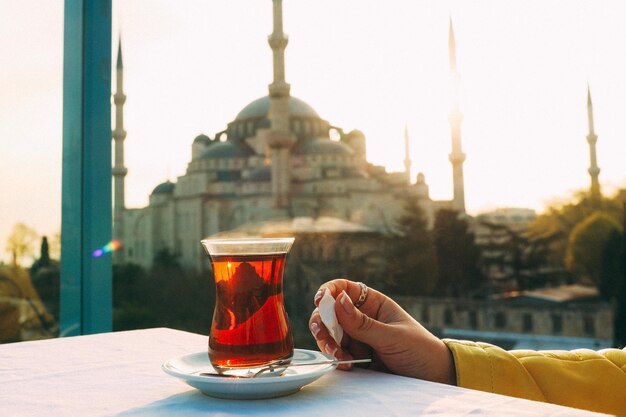 A glass of Turkish tea on the background of Hagia Sophia in Istanbul