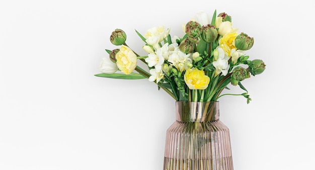 Glass vase with flowers isolated on white background