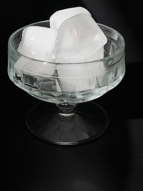 Glass vase with ice cubes