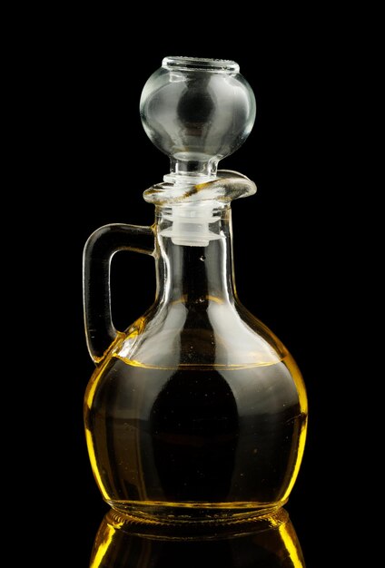 Glass vessel with oil black background