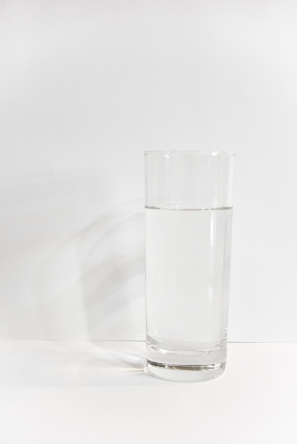 Photo glass of water against white background