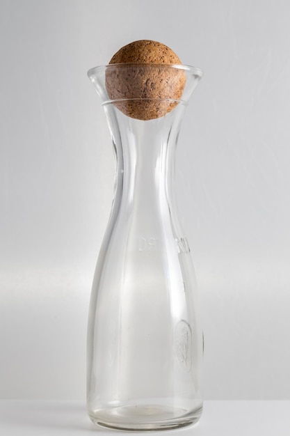 Glass water bottle with ball-shaped cork stopper