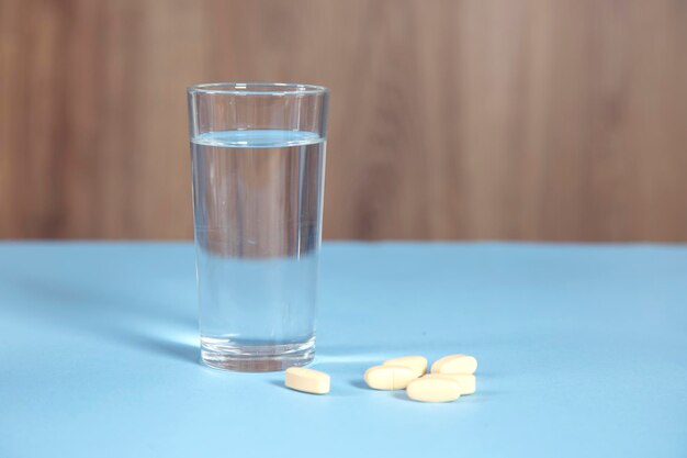 Glass of water and drug