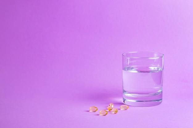 Glass of water and pills treatment