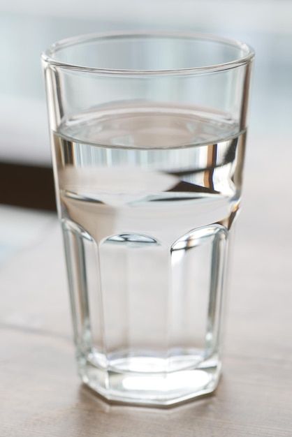 A glass of water on table close up