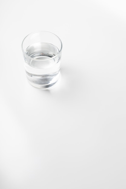 Glass of water on white background