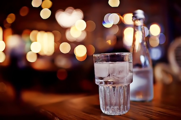 glass of water with ice in the restaurant / cold clear clear water in a glass with ice pieces