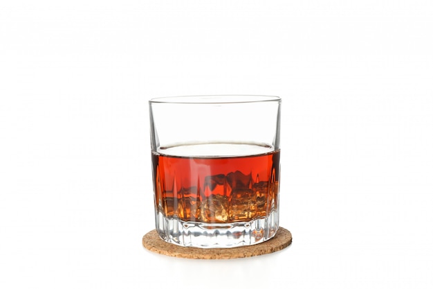 Glass of whiskey on coaster isolated on white background