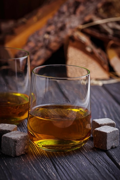 Glass of whiskey with stones 