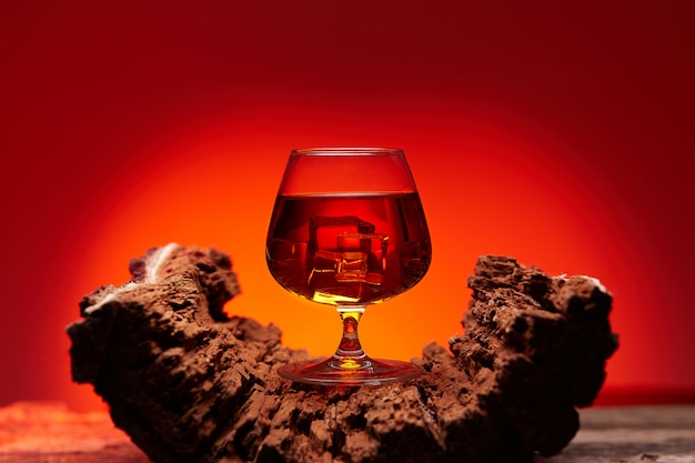 Glass of whiskey on wooden table