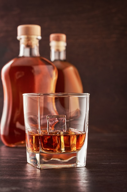 Glass of whiskey on a wooden table