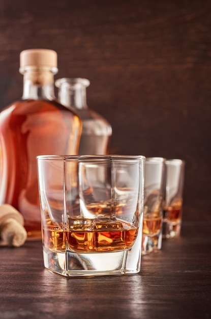 Glass of whiskey on a wooden table